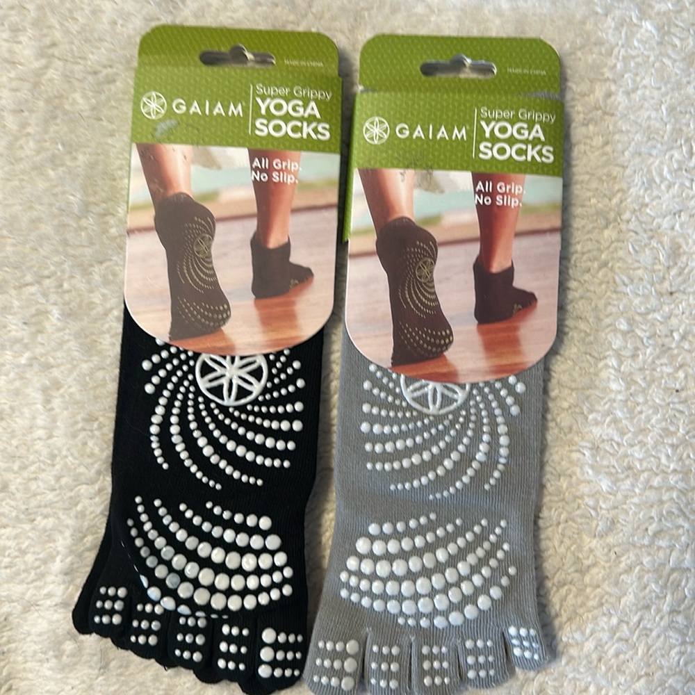 Gaiam Supper Grippy Yoga socks. two pairs. black/grey size in women 5-10